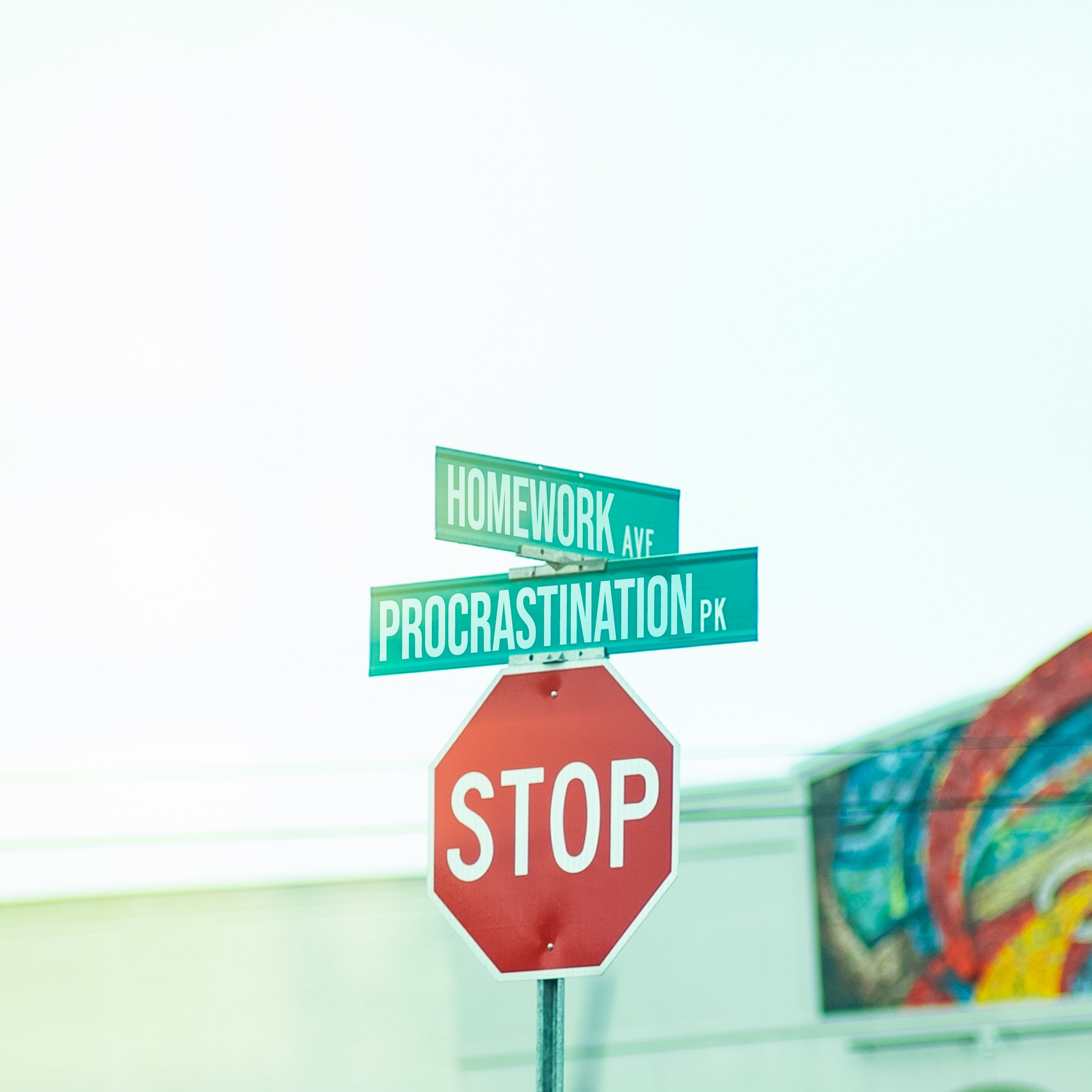 Stop sign with photoshoped street names: "Homework Ave" and "Procrastination Pk".