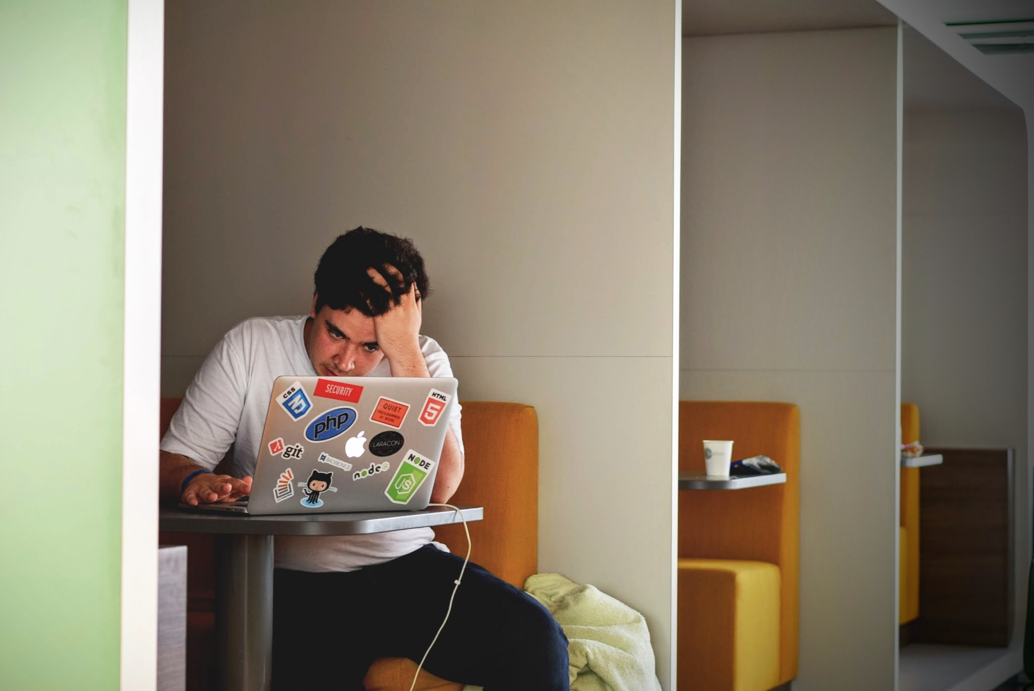 Student studying in a cubicle on a computer